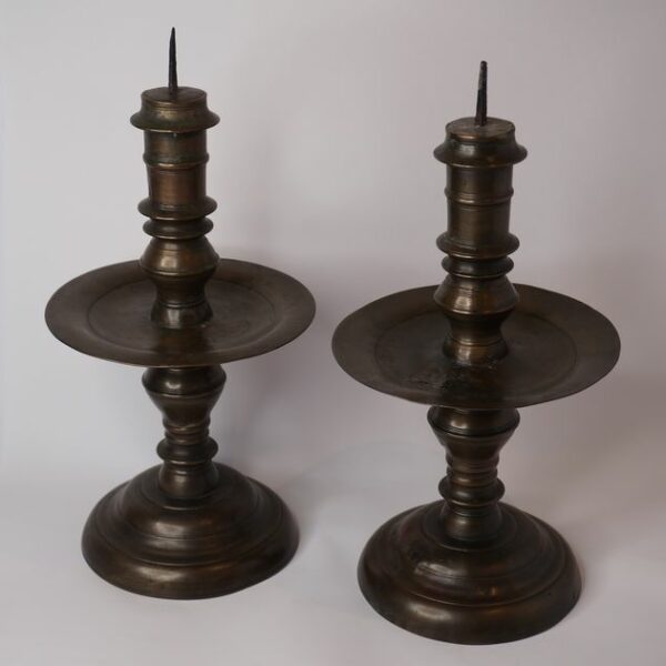 Pair of bronze colonial candlesticks, early 18th century